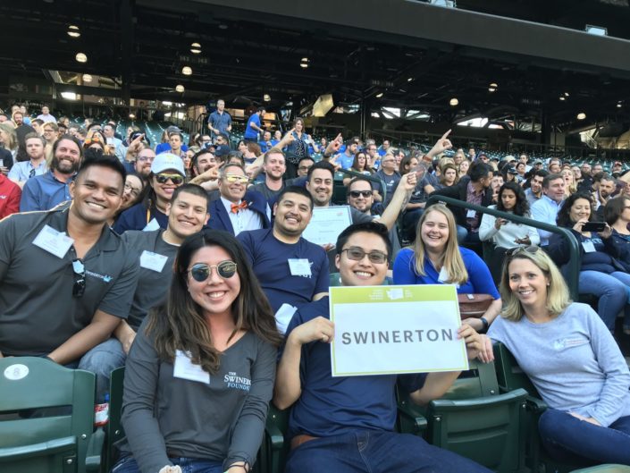 Seattle team holding Swinerton sign at baseball stadium